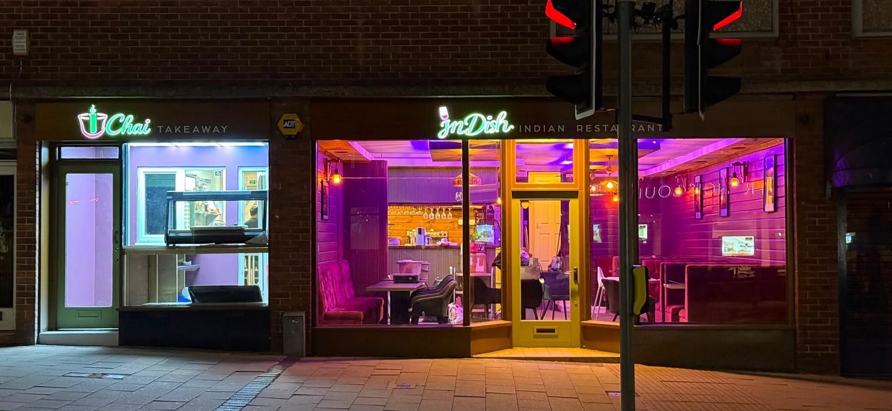 InDish and iChai lit up at night on South Street, Exeter
